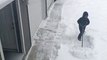 Girl Tries Her Best to Shovel Snow