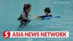 The Straits Times | Single mum with dyslexic boys teaches special-needs kids to swim