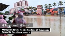 Malaysian towns flooded as tens of thousands forced to flee rising waters