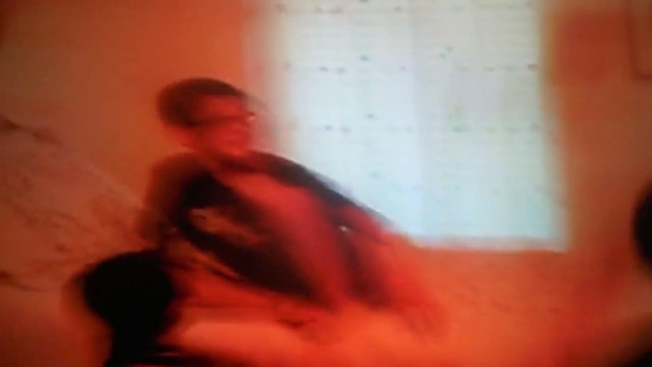 Christopher playing the wii while Jonathan & Anthony Joke around