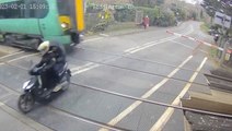 Moped narrowly avoids 70mph train after dodging barriers at level crossing