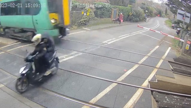 Moped narrowly avoids 70mph train after dodging barriers at level crossing