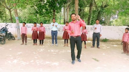 kids fun with teacher I spoon race in school