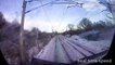 Shocking footage shows moment a pedestrian was just inches away from being hit by a speeding train