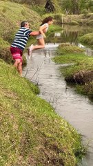Family Fails to Help Daughter Across Stream