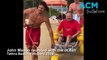 Tathra Lifeguards assist John Mason back into the surf, February 2023, Bega District News