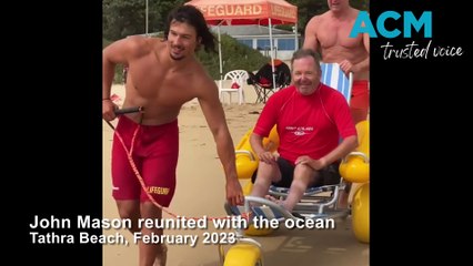 Tathra Lifeguards assist John Mason back into the surf, February 2023, Bega District News