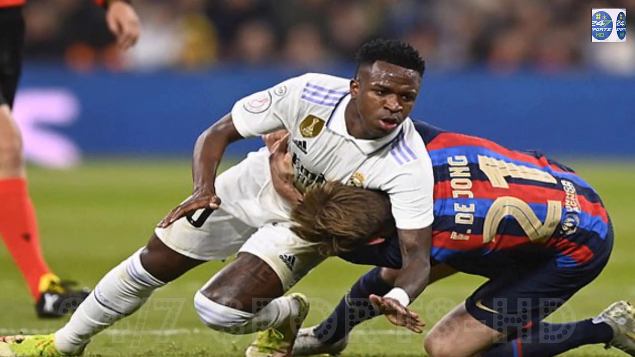 WrestleMania! Real Madrid star Vinicius Jr tangles with Man United target Frenkie De Jong in Barcelona's 1-0 Clasico win... with the Brazilian grabbing the Dutchman's neck and dragging him to the ground