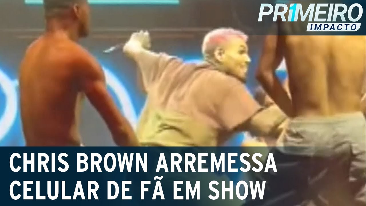 Chris Brown se irrita com fã e atira celular na...