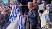 Sheffield Wednesday chairman Dejphon Chansiri waves an Owls shirt in celebration at their win over Peterborough United