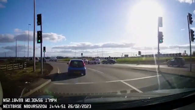 Motorcyclist falls off his bike while attempting risky stunt on roundabout