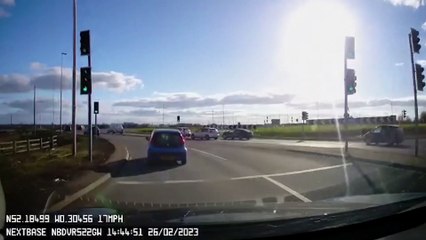 Motorcyclist falls off his bike while attempting risky stunt on roundabout