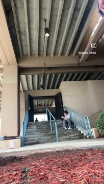 Skateboarder attempts to board slide handrail then falls and hits top of head (Angle 2/2)