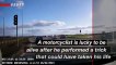 Shocking Moment Motorcyclist Failed Stunt on Busy Roundabout