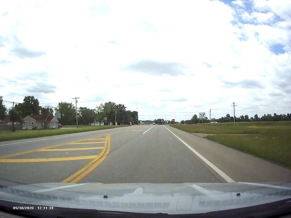 Driver Collides with Stop Sign Running Vehicle