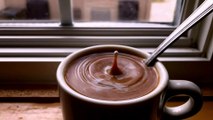 Coffee Creamer Drops Into Coffee Slow-Motion