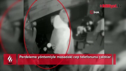 Perdeleme yöntemiyle masadaki cep telefonunu çaldılar