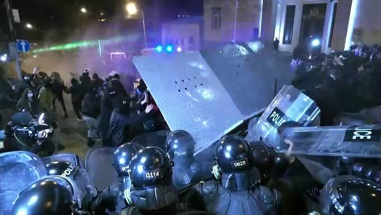 Georgian police fire water cannon and stun grenades at protesters outside Tbilisi parliament