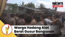 Sejumlah Warga Hadang Alat Berat Gusur Bangunan Di Pekanbaru