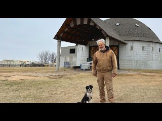 A round barn rises in rural America. There is grief and hope in its