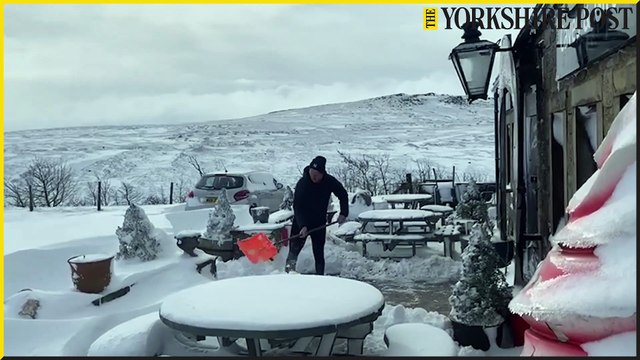 Heavy snowfall in Yorkshire Dales as Lisa Bowerman of Stump Cross Caverns surveys snowy scenes
