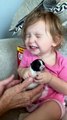 Little Girl Reacts to Holding Tiny Puppy