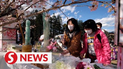 Fukushima mourners 'live with sorrow' on anniversary