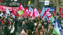 Protesters in France urge President Macron to scrap pension reform plans