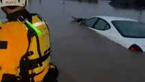 Floodwater surrounds cars after powerful storm hits California