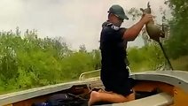 Moment police rescue baby kangaroo from ‘crocodile-infested floodwaters’