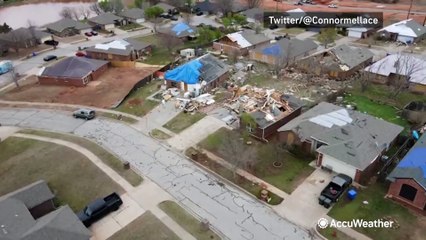 Multiple homes covered in blue tarps in tornado recovery