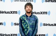 Louis Tomlinson is 'proud' of co-writing One Direction songs