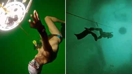 Moment swimmer completes deepest-ever freedive under frozen lake