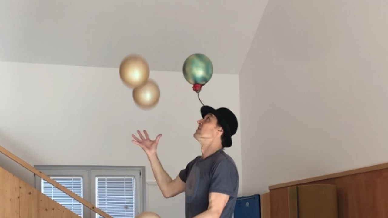 'That's unbelievable!' - Juglar impressively juggles 5 balls balancing atop 3 Rola-bola  while spining a ball on hat
