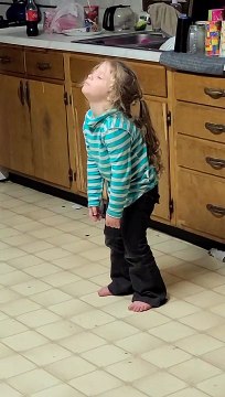 Tired Three-Year-Old Falls Asleep Standing Up