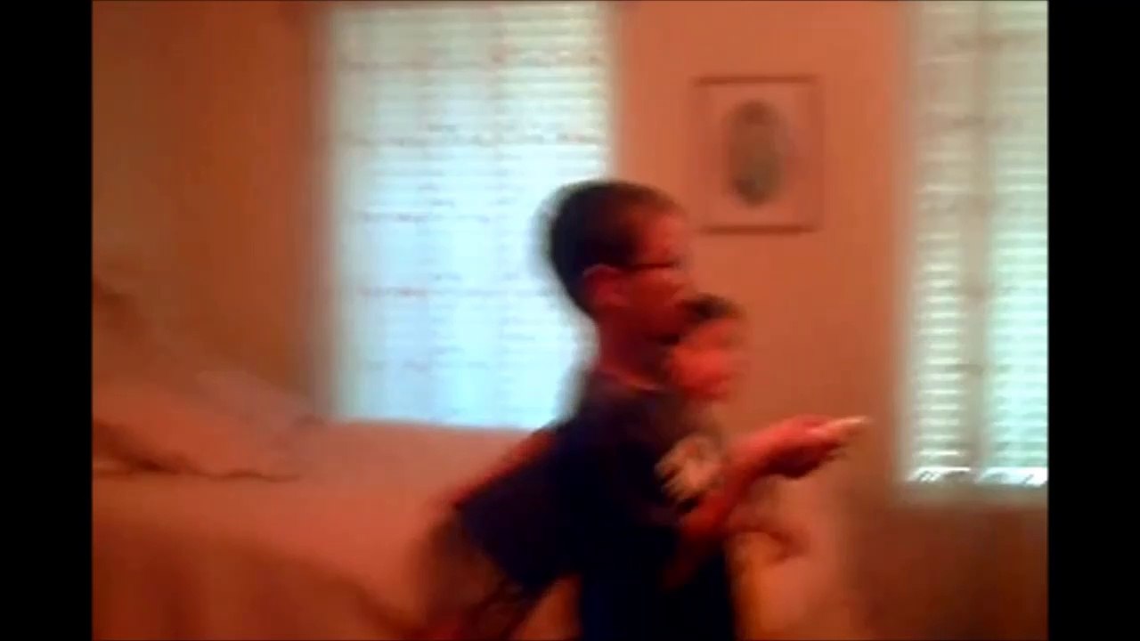 Jonathan playing the wii while Christopher & Anthony beat each other up