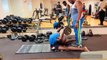 Man Lifts Heavy Weight While Doing Backbend Exercise