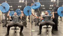 Bodybuilder fails to keep his arms up with two heavy kingpins!