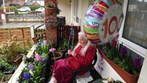 Violet Fortt knitting poppies at 100 years old