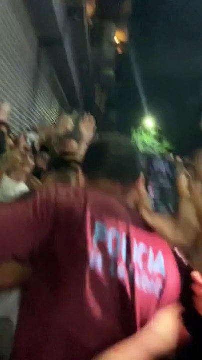 Lionel Messi smiling amidst chaos