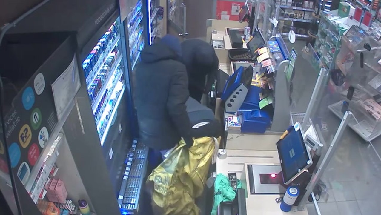 Gang of balaclava-clad men armed with crowbars steal more than £3,000 from Surrey Co-op