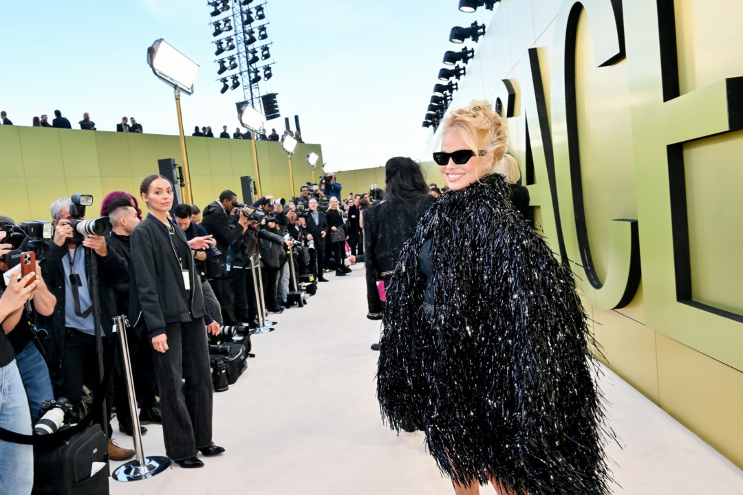 Pamela Anderson Paired Her Khaki Miniskirt With a Matching Trench Coat