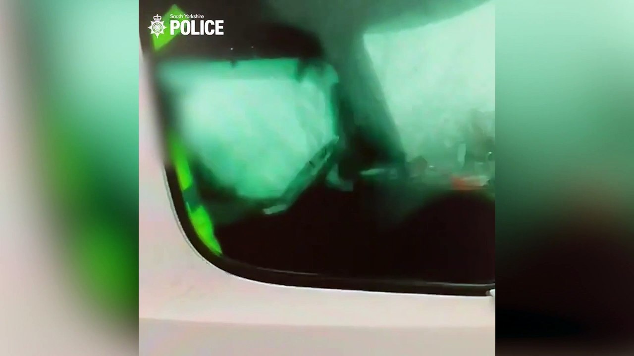 Brazen lorry driver caught barely clasping steering wheel while taking a picture on phone