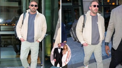 Ben Affleck cut a casual figure in a tan zip-up over a light grey t-shirt.