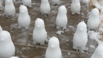 Mom builds DOZENS OF SNOW PENGUINS after kids refuse to play with her on snow day