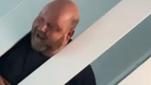 Man gets his head hilariously stuck between the stair railing