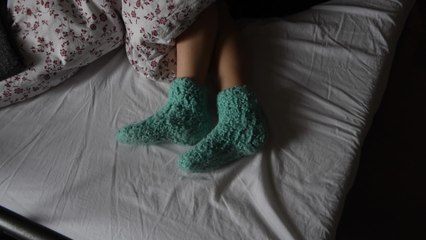 Here's why you should never wear socks to bed