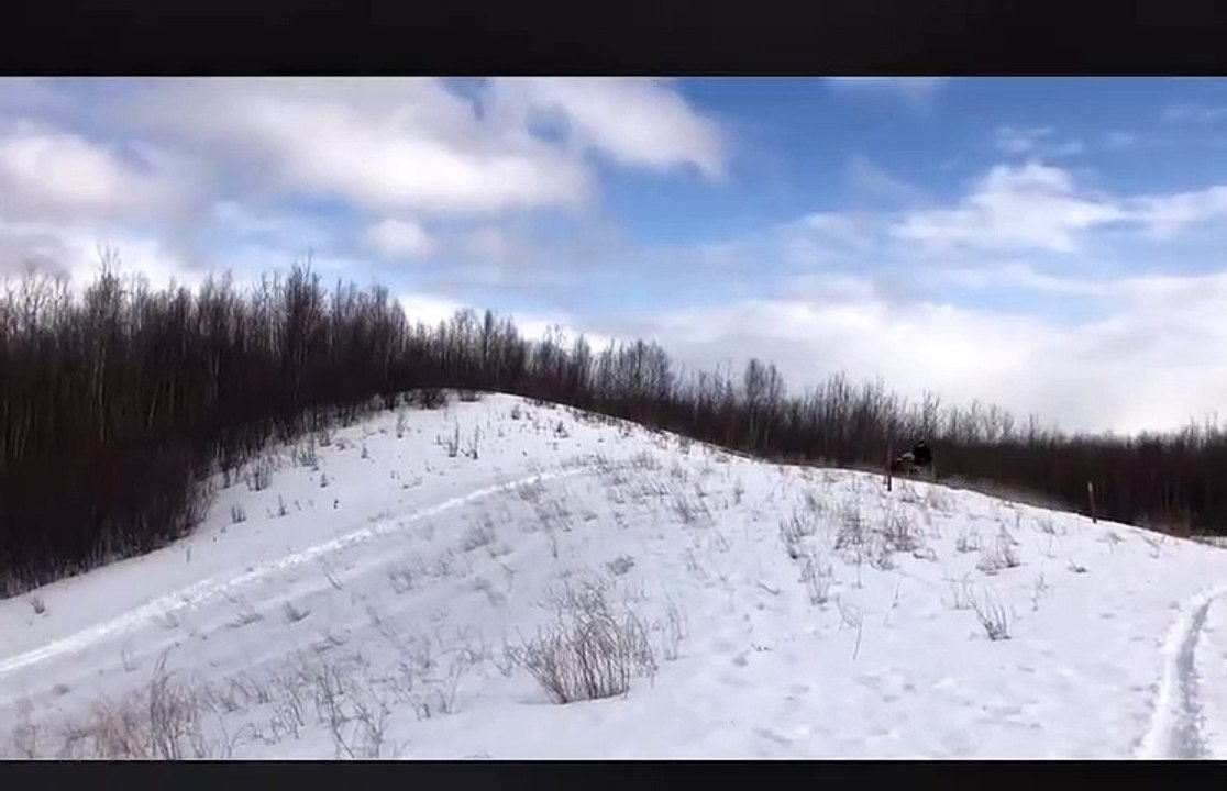 Snowmobiler Full Sends It Over Hill