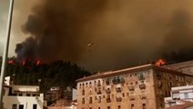Thick smoke clouds fill sky as hundreds of firefighters tackle Spanish wildfire
