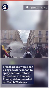 Pension-Reform Protesters Use Umbrellas to Deflect Police Water Cannon in Rennes